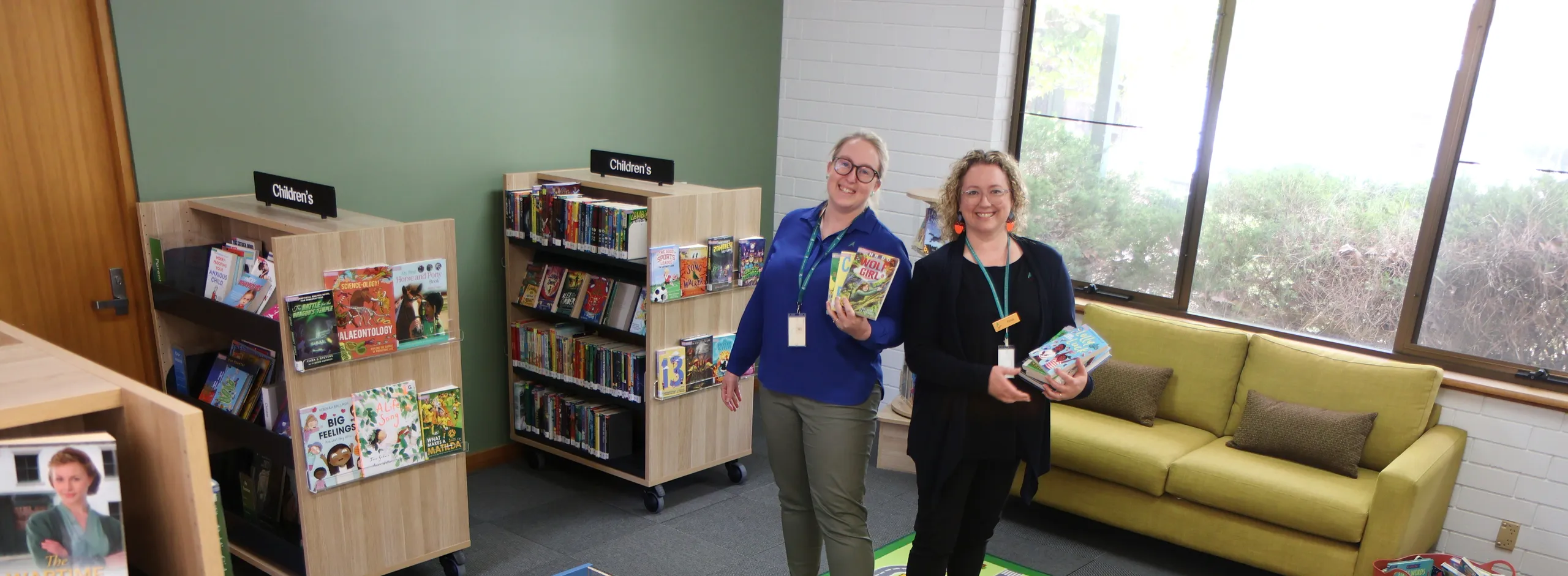 Two library services officers in the revamped Mount Pleaseant Library space