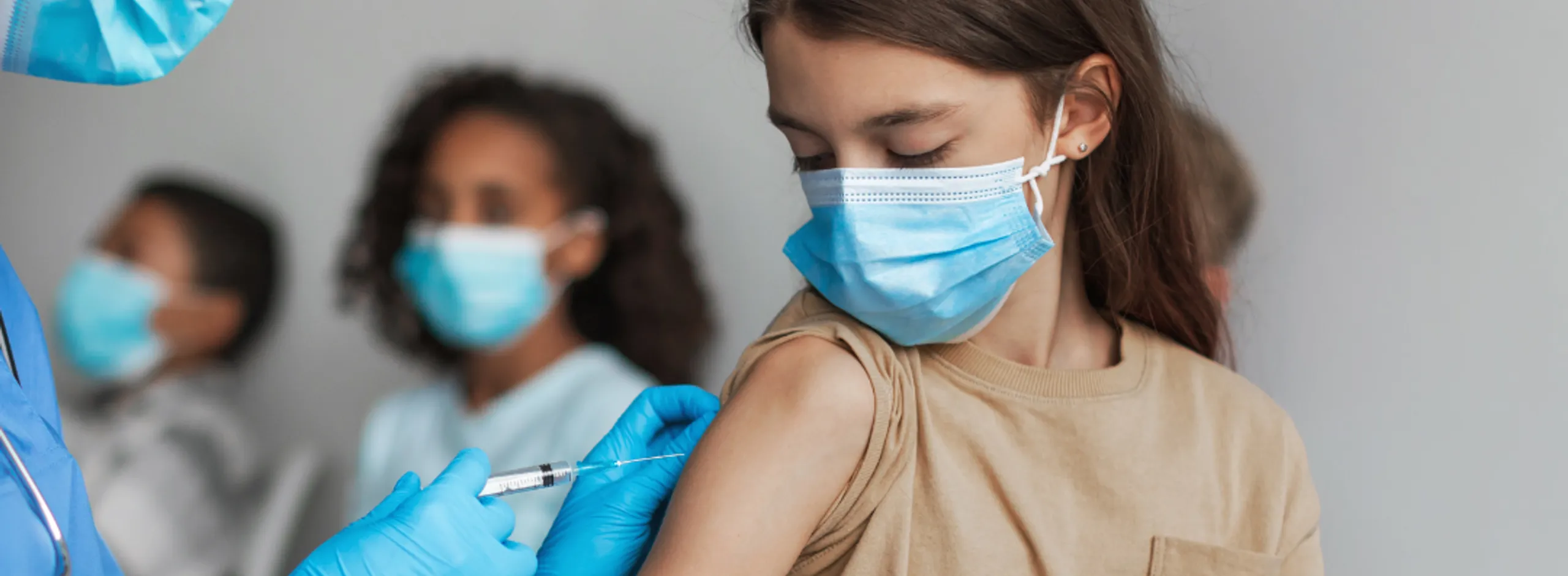 Child receiving immunisation shot