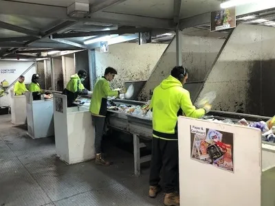 Container sorting line at recycling facility