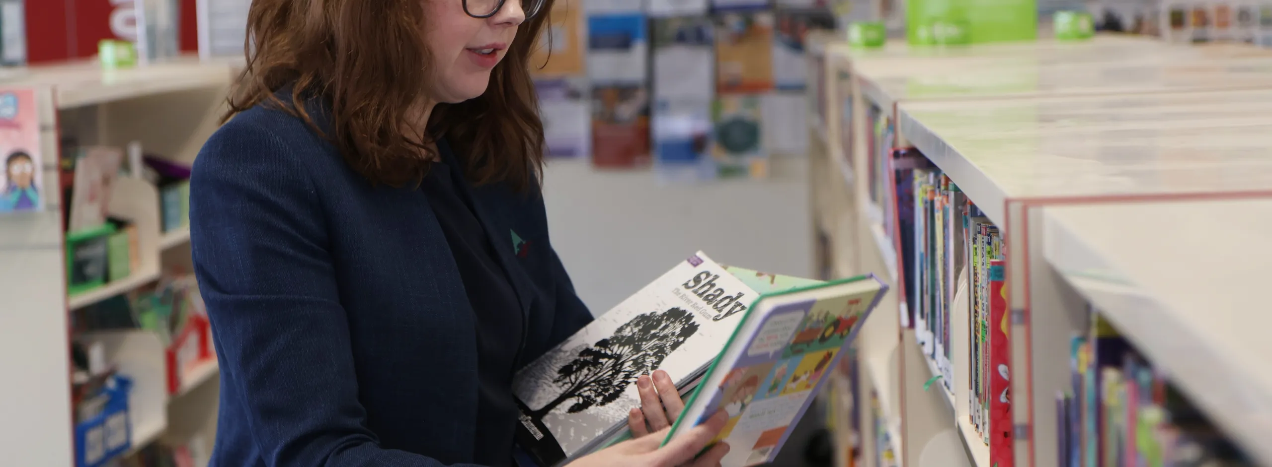 Jessalyn putting books away