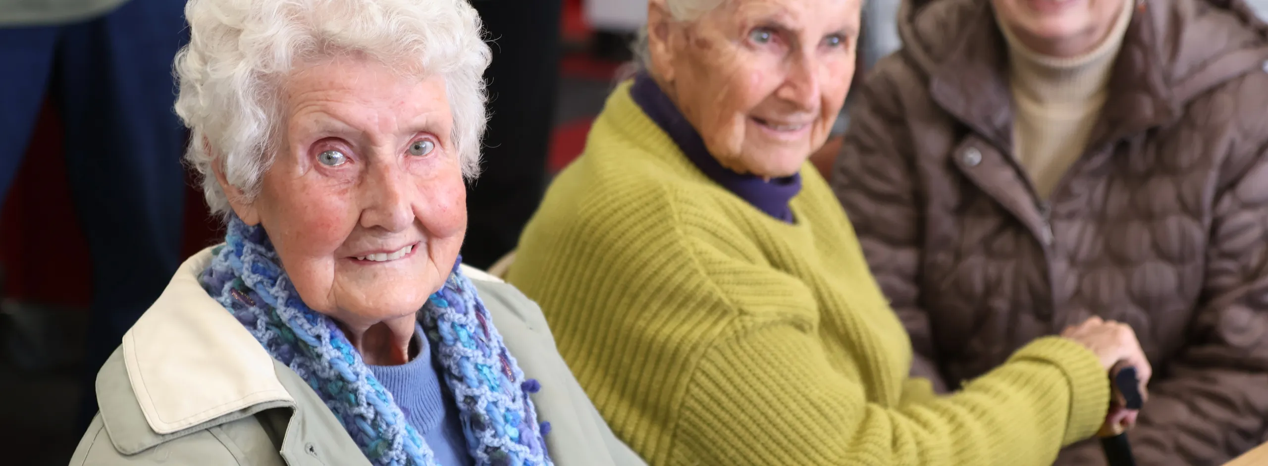 three older ladies smiling