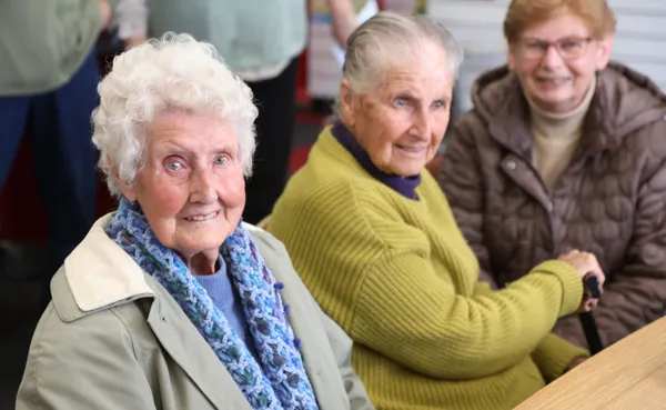three older ladies smiling