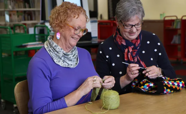 Two women working on crochet