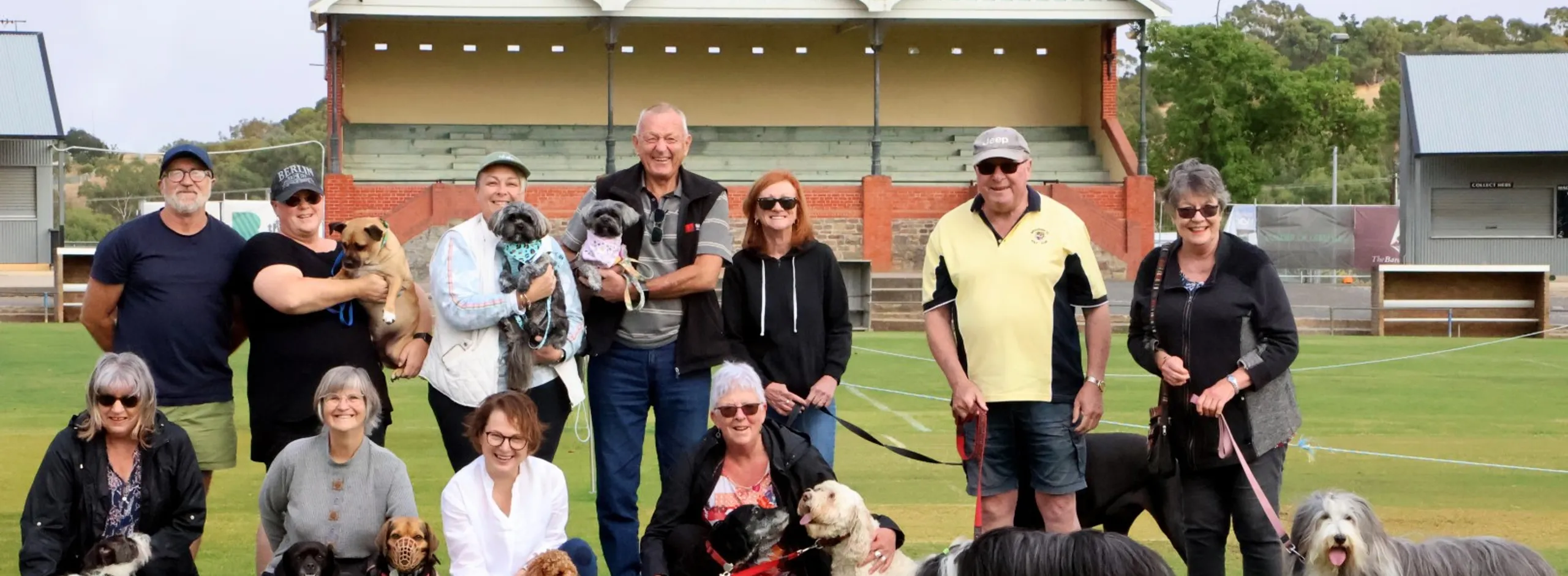 large group of dog walkers at Tanunda Oval in front of grand stand