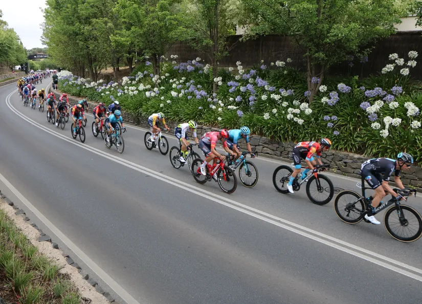 Bike riders racing through Tanunda archway