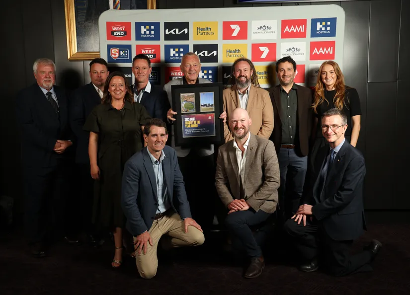 Group of eleven people, including Mayor Bim Lange, with the award.